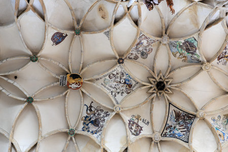 Intricate medieval ceiling art with heraldic symbols and star pattern in historic building.. March 22, 2025, Kutna Hora, Czech Republic.のeditorial素材