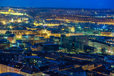 Nighttime aerial view of prague cityscape with illuminated buildings and streets. March 22, 2025 Prague Czechia.のeditorial素材
