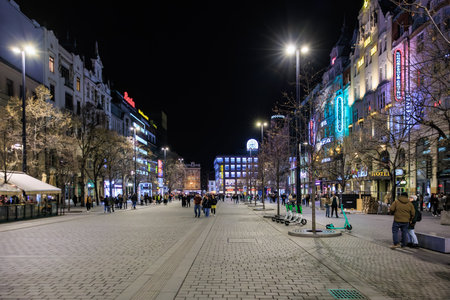 Night scene of wenceslas square with neon lights and urban activity. March 22, 2025 Prague Czechia.のeditorial素材