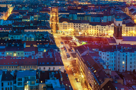 Night view of vibrant urban cityscape with illuminated streets and historic buildings. March 22, 2025 Prague Czechia.のeditorial素材