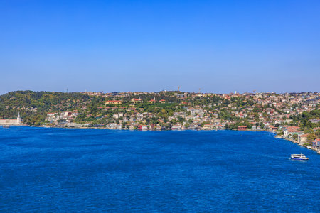 Panoramic view of bosphorus strait and european istanbul coastline under clear blue sky.の写真素材