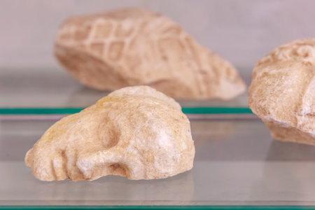 Ancient stone carving: an antique fragment of a human face, the cultural heritage of the world from...