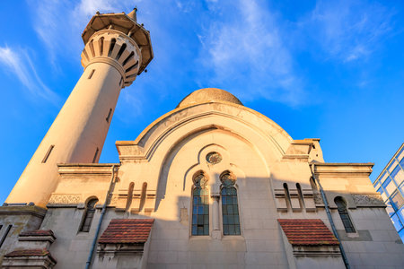 Majestic architectural details of historical mosque in blue sky backdrop.の写真素材