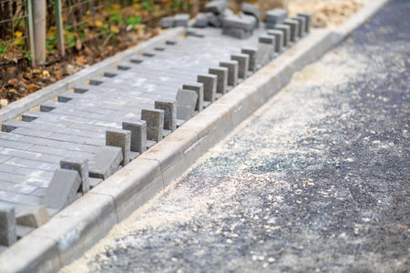 Pavement construction with concrete pavers on sidewalk project site.の写真素材
