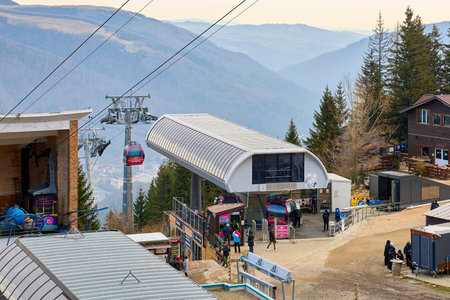 Gondola station in mountainous landscape, a ski resort in winter without snow. December 14, 2025 Sinaia Romania.のeditorial素材