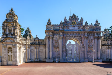 Ornate entrance gate of dolmabahce palace in istanbul under clear blue sky. August 12, 2025 Istanbul Turkey.のeditorial素材