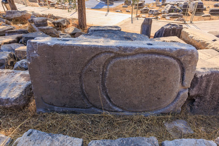 Ancient stone with carved inscriptions in archaeological site. August 8, 2025, 2 Didim Turkey.のeditorial素材