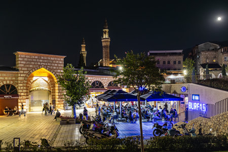 Nightlife with outdoor dining and lit minarets. August 9, 2025, 2 Bursa Turkey.のeditorial素材