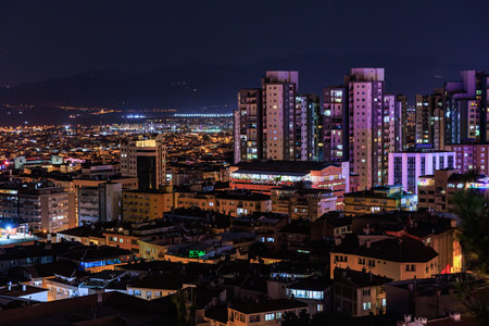 Night view of Bursa city skyline with illuminated high-rise buildings. August 9, 2025, 2 Bursa Turkey.のeditorial素材