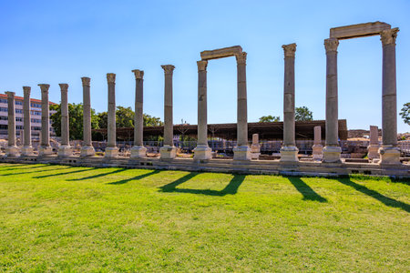 Ancient roman columns: historical architectural ruins under clear blue sky. August 4, 2025, Izmir Turkey.のeditorial素材
