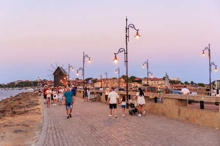 Evening stroll on cobblestone pathway in scenic european port town. August 1, 2025, Nessebar Bulgaria.のeditorial素材