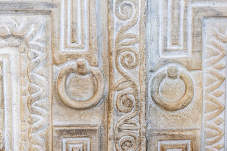 Ornate carved stone detail with geometric and swirl patterns.の写真素材