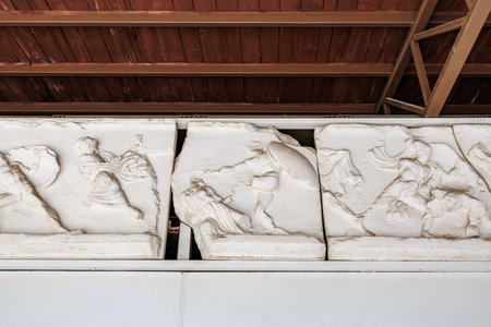 Ancient greek marble reliefs depicting mythological scenes and battles.の写真素材