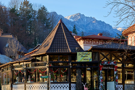 Cozy mountain village eatery with rustic charm in picturesque setting. December 13, 2025 Sinaia Romania.のeditorial素材