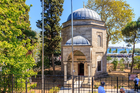 Historic ottoman mausoleum with stone architecture in lush garden setting. August 12, 2025 Istanbul Turkey.のeditorial素材