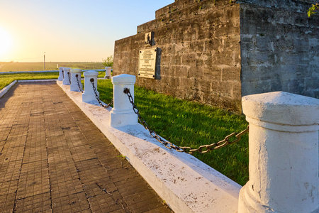 Historic fort at sunset with weathered stone and white pillars. May 2, 2025, Vulcanesti Moldova.