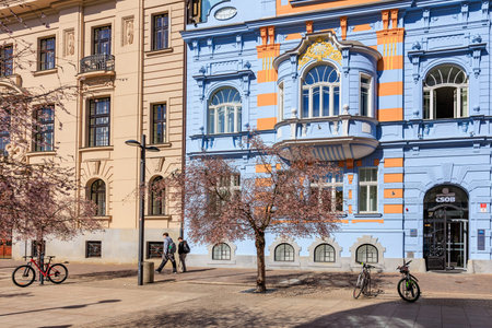 Colorful european street scene with historic architecture and spring blossoms. March 21, 2025, Ceske Budejovice, Czechia.のeditorial素材