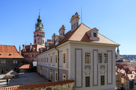 Historic cesky krumlov castle with tower and orange roofs under blue sky. March 20, 2025, Cesky Krumlov, Czechia.のeditorial素材