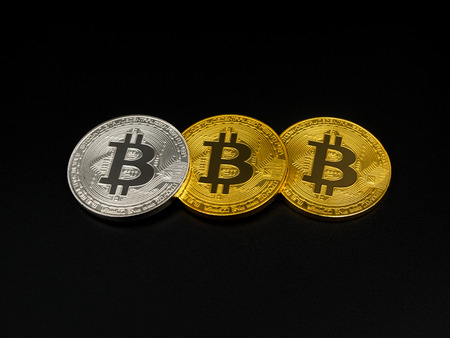 Golden and silver bitcoin on black. Bitcoin cryptocurrencyの写真素材