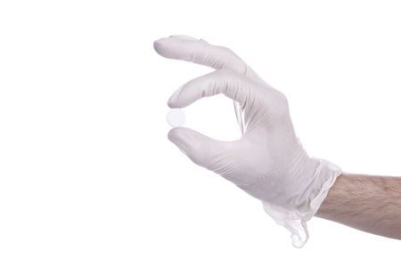 right hand holds a white pillの写真素材