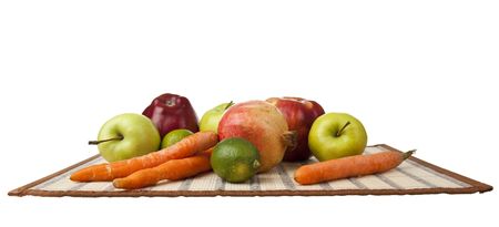 tray of apples, a pomegranate, carrots horizontallyの写真素材