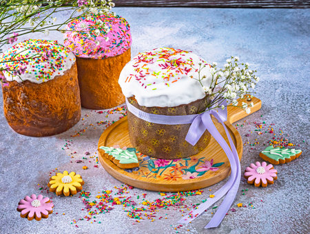Easter cake and gingerbread cookies on a stone background. selective focus.の写真素材