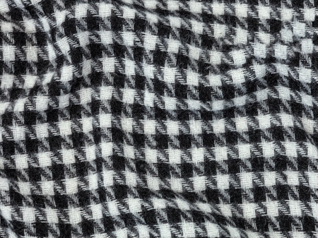 Texture, background, pattern. Woolen fabric, black and white checkered pattern. Checkered pattern on a white backgroundの写真素材