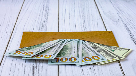 Envelope with money on a wooden background. close-up.