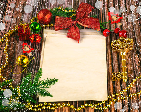 Christmas greeting card on wooden background. Top view with copy space.の写真素材
