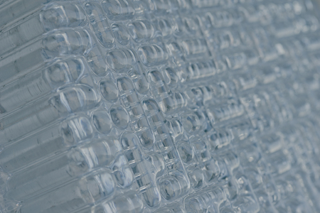 Background texture corrugated glass, pattern. Close-up, selective focus, side view, copy space.の写真素材