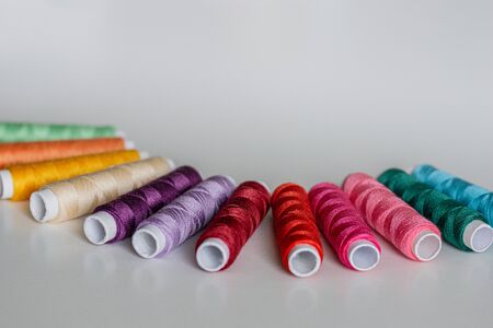 Colorful spools of thread form a beautiful rainbow