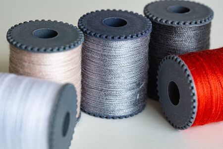 Colorful spools of thread form a beautiful rainbow