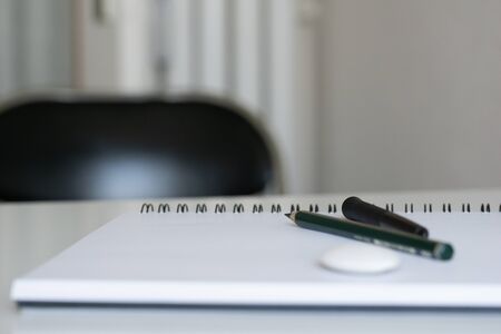 Pencil and notebook with space for text or image, selective focus. Blank notebook with pencil on white desk background.の写真素材