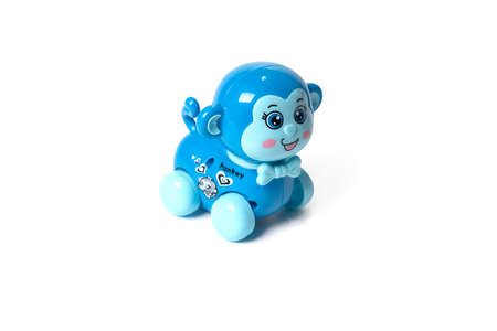 Plastic toy monkey on a white background.の写真素材