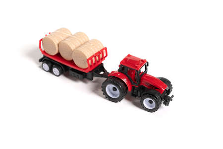 Red toy tractor isolated on white background.の写真素材