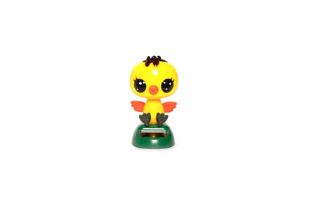 Yellow plastic chicken toy isolated on white. high quality photoの写真素材