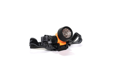 Isolated headlamp flashlight with straps for the headの写真素材