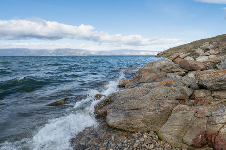 Beautiful summer landscape of Baikal Lake on sunny day. View of the rocky capeの写真素材