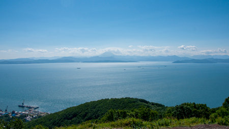 Avacha Bay of the Pacific Ocean mountains and blue skies. Kamchatka Peninsula.