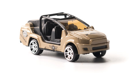 Plastic toy army car isolated on white background
