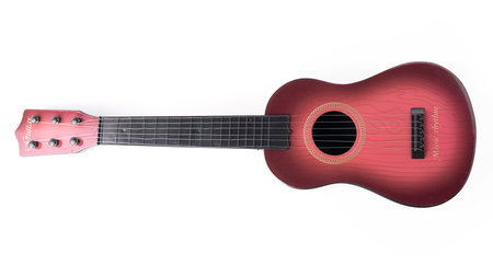 Electric toy guitar isolated on white background.の写真素材