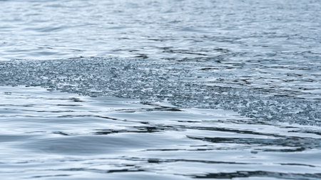 Broken Sea Ice Floating in Dark Arctic Oceanの写真素材