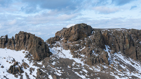 Rugged mountains with a dusting of snow at Deception Island, Antarctica. High quality photoの写真素材
