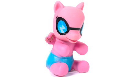 Pink unicorn plastic toy. Isolated on white backgroundの写真素材
