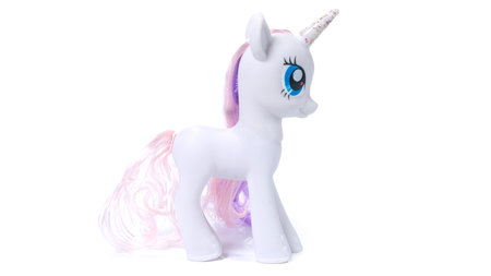 White unicorn plastic toy. Isolated on white backgroundの写真素材