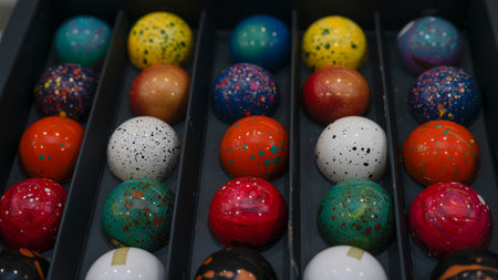 Candy chocolate balls sweats sprinkled with pigments in box.の写真素材