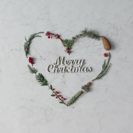 Heart shape made of natural winter foliage. Christmas concept. Flat lay.の写真素材
