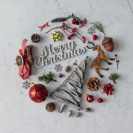Creative arrangement of Christmas decoration on marble table. Holiday concept. Flat lay.の写真素材