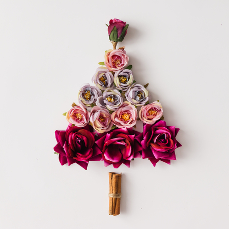 Christmas tree made of flowers and cinnamon sticks. Flat lay. Holiday concept.の写真素材