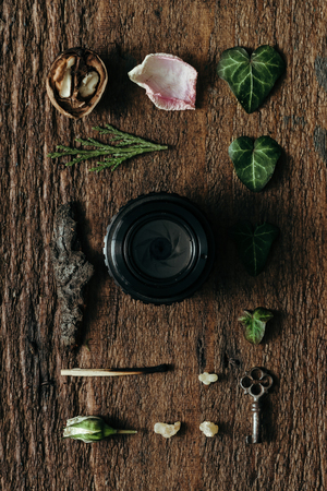 Creative arrangement of natural things with camera lens. Flat layの写真素材